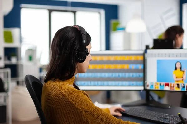 Filmmaker editing a video on her computer.