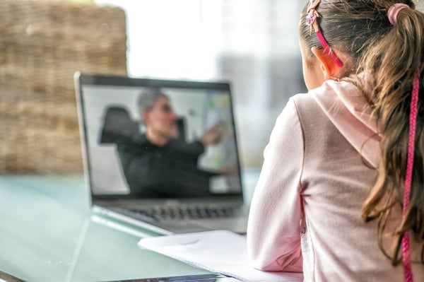 Young girl student studying instructor on laptop screen.