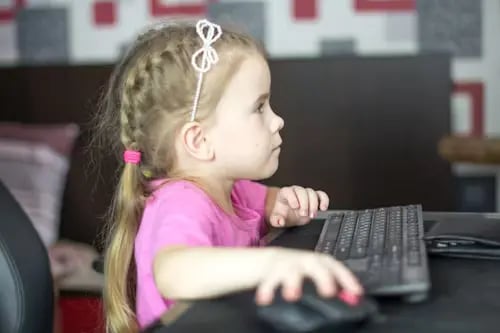 An elementary student engages in microlearning videos.