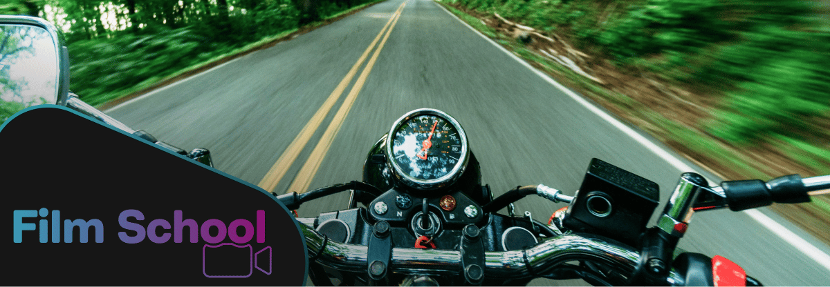 First-person POV of person riding on motorcycle. WeVideo Film School logo in bottom left corner. 